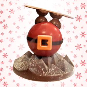 Père noël en chocolat la tête dans la neige